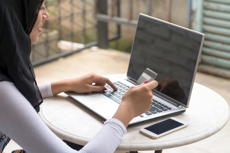 A student makes a payment on their laptop